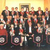 Easter 2004 - Antrobus House Concert. MD - Oliver Jeans LRSM.
The occasion was held as a Thank You Presentation to long serving member David Shutler by our first lady Chairman; Sandra King

Back Row: Andrew Carter, John Baker, Max Carter, Andrew Blakeborough, Anthony Blakeborough, Jacob Burgess, John Vent, Ray Brotherton.
Middle Row: Dennis Burgess, Mervyn Smith, Bob Travis, Peter Hollingdale-Smith, Martin Mortimer, Peter Cowdrey, Richard King, Don Palmer, Brian Carter, Andrew Baker, Brian Watts, Matt Spencer, Phil Marston,
Front Row: David Shutler, Ruth Tuck, Sandra King, Oliver Jeans, Glenys Hollingdale-Smith, Jean Jackson.
